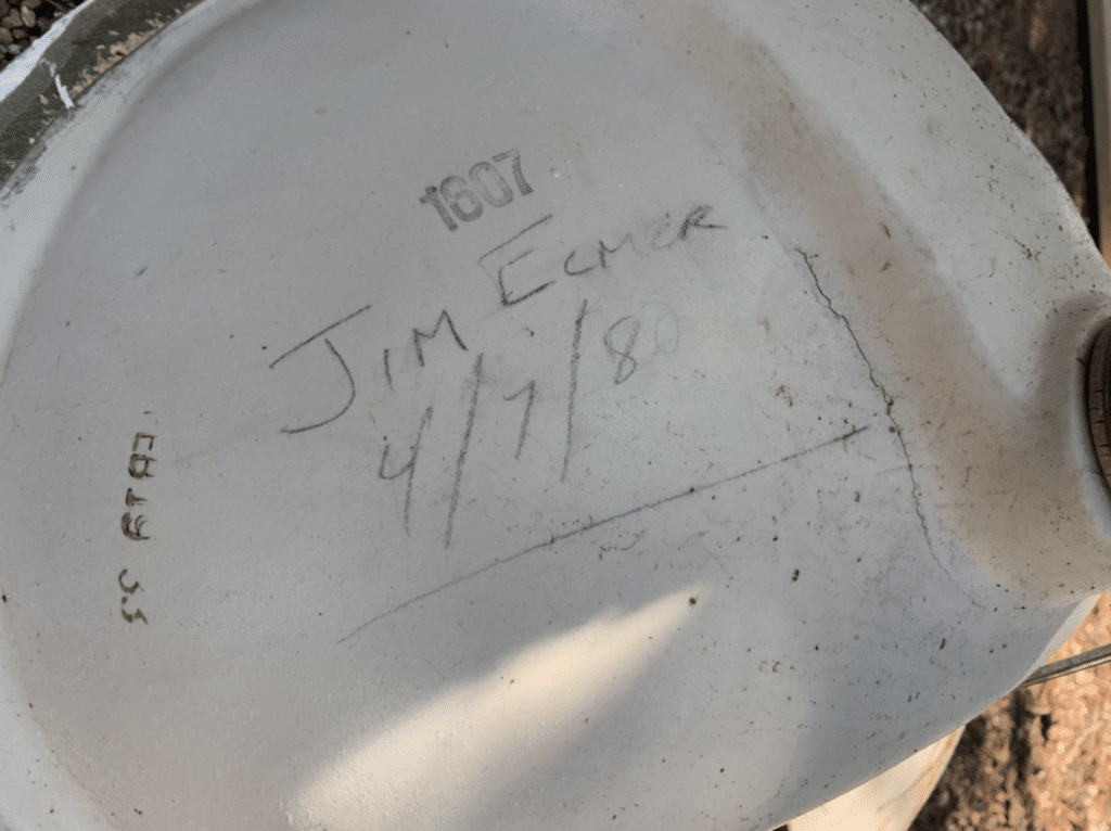 bottom of bathroom sink with writing