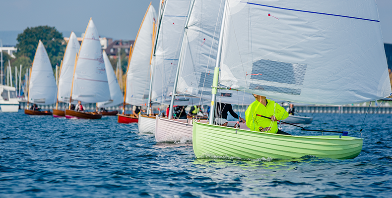 mast and keel sailboats on water