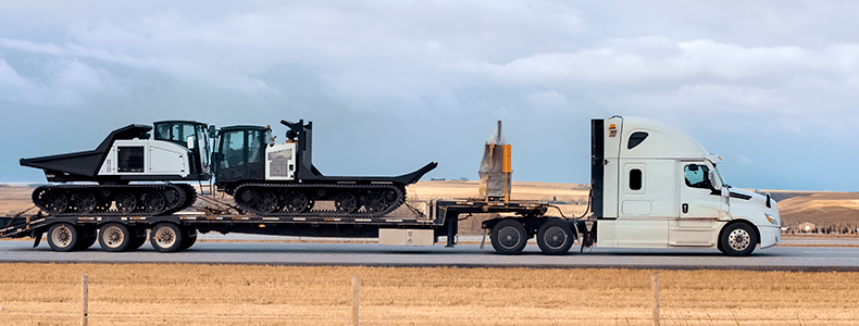 heavy equipment on trailer for transport