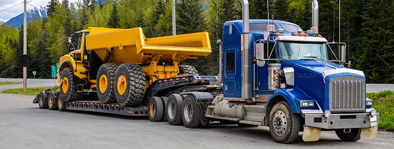 heavy equipment shipping on semi