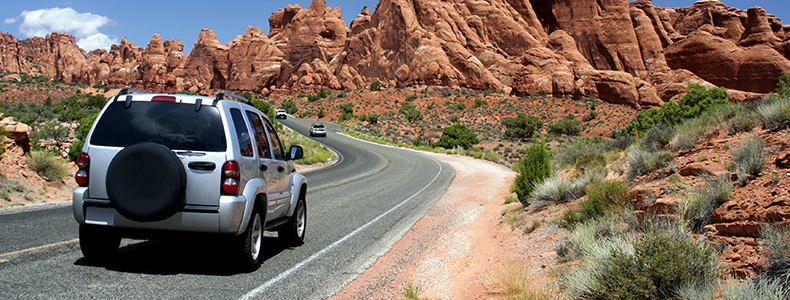 car on open desert road