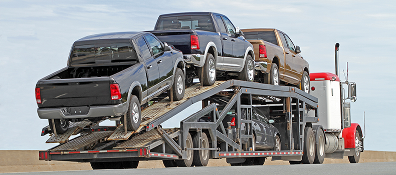 Open trailer shipping multiple vehicles