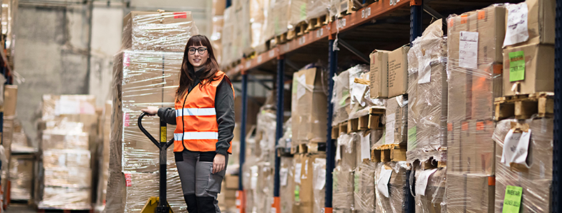 woman in warehouse providing Less Than Truckload Services