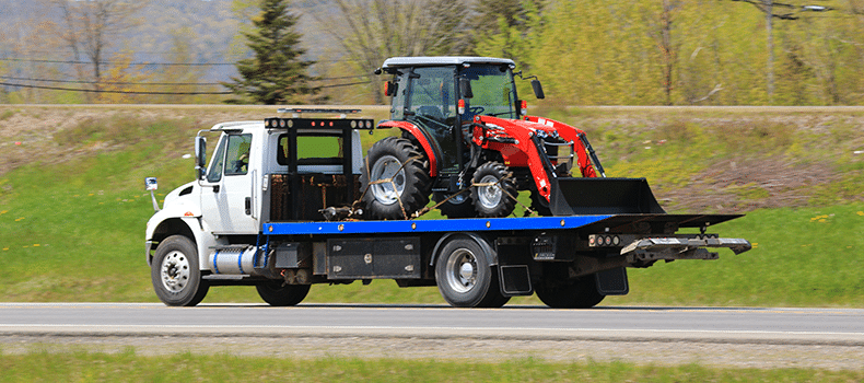 tractor on flatbed truck is often the cheapest way to ship a tractor