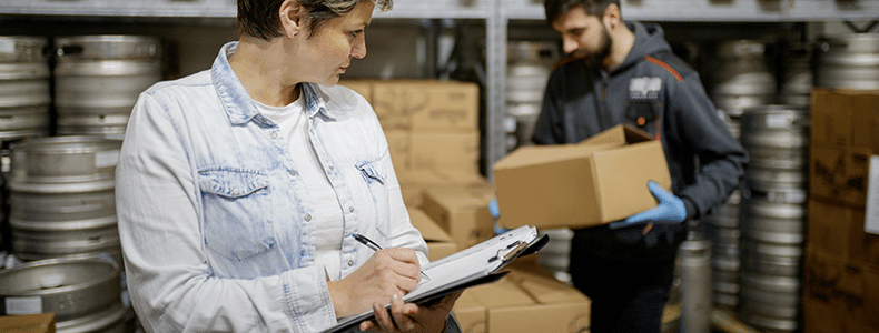 business shipper packaging alcohol in warehouse